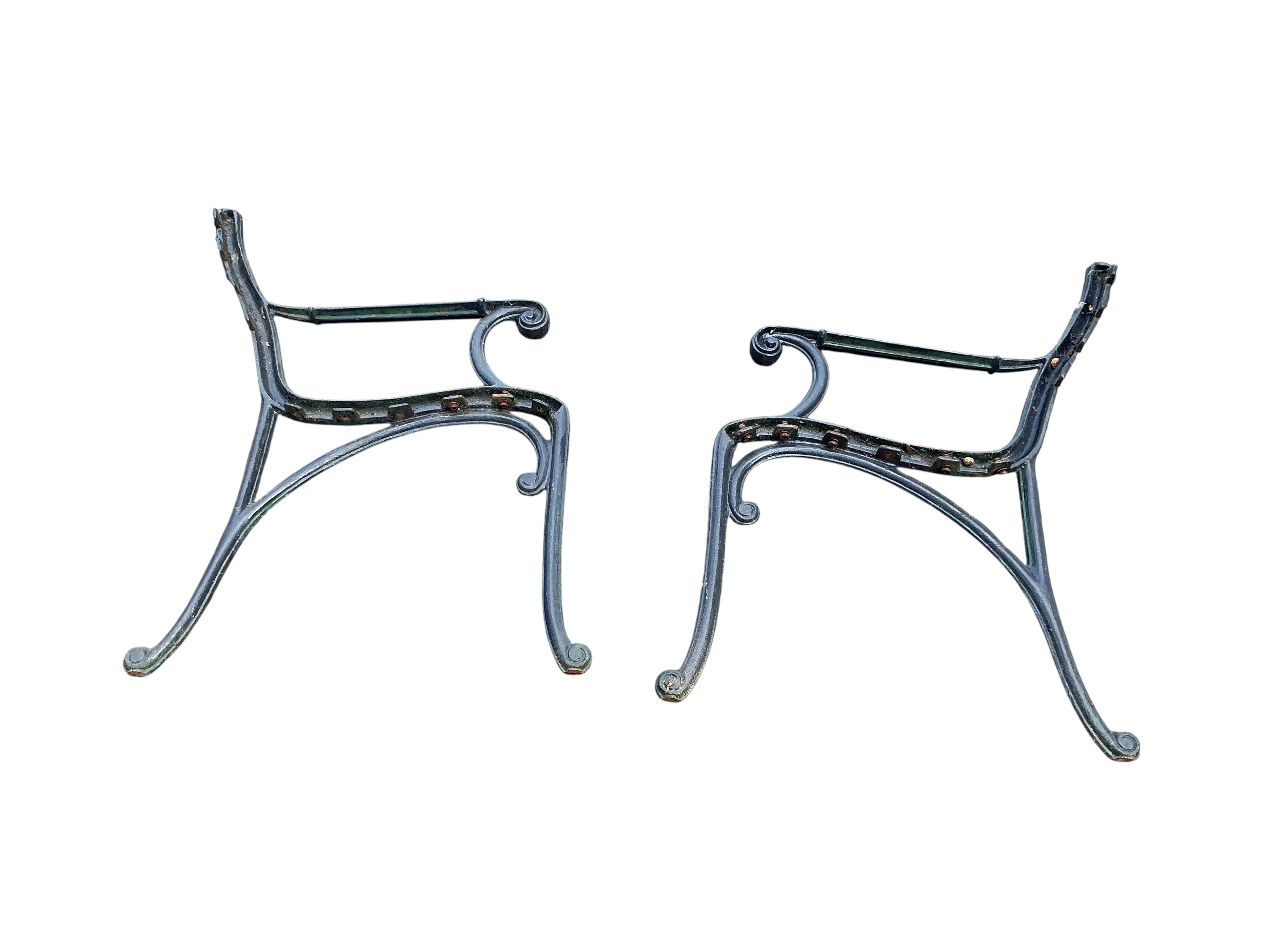 A cast metal slatted garden bench, width 115cm, together with three matching garden armchairs and four bench ends